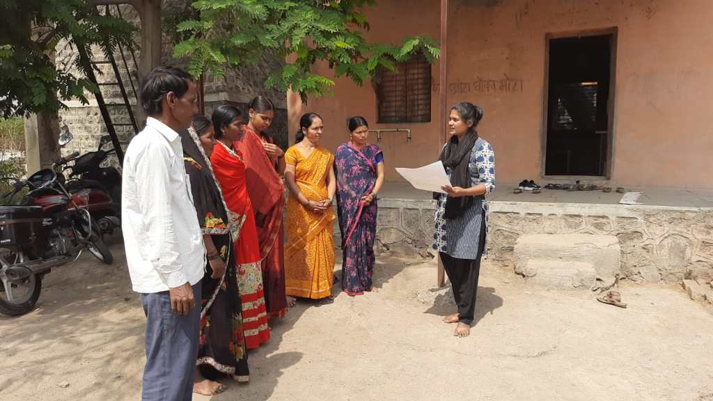 Savine Ventures addressing women in an outdoor rural setting during CSR program